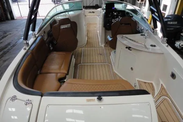 Slide: The Image of 2007 Sea Ray 260 Sundeck interior with tan seating and sleek design. - 6
