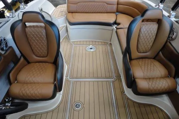 Slide: The Image of Luxurious interior of a 2007 Sea Ray 260 Sundeck with tan leather seating. - 9