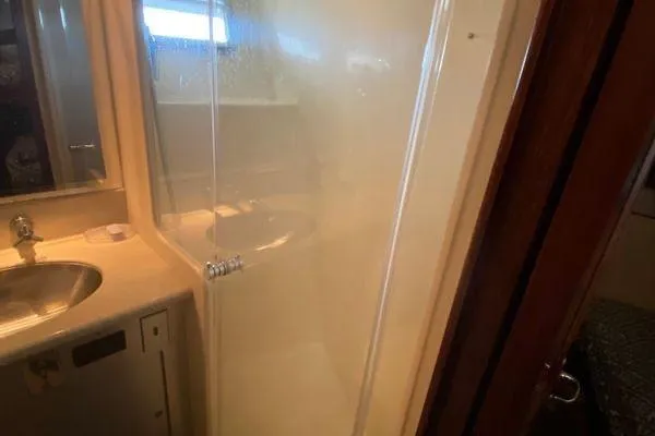 Slide: The Image of Bathroom interior of 1983 Hatteras 53 Extended Deckhouse Motor Yacht with shower and sink. - 11