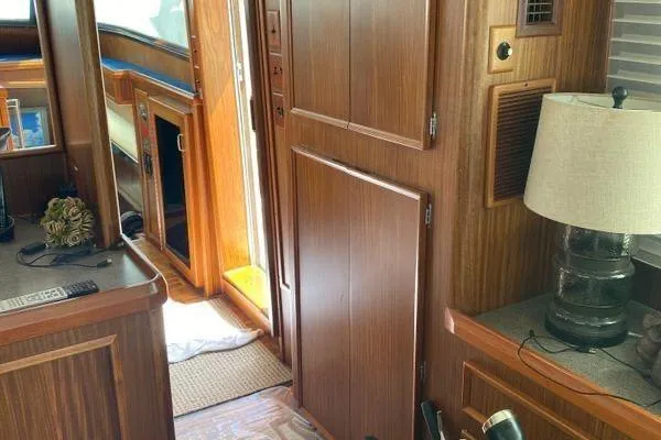 Slide: The Image of Interior of 1983 Hatteras 53 Motor Yacht with wood paneling and lamp. - 15