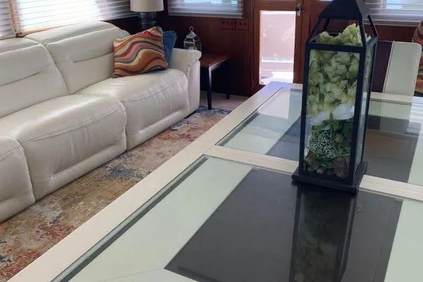 Slide: The Image of Luxurious interior of 1983 Hatteras 53 Motor Yacht with elegant decor and comfortable seating. - 16