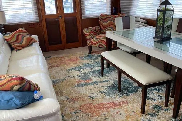 Slide: The Image of Interior of 1983 Hatteras 53 Motor Yacht with modern decor and colorful accents. - 18