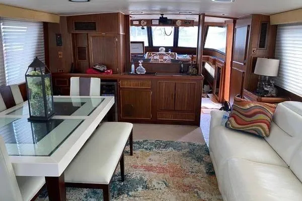 Slide: The Image of Interior of 1983 Hatteras 53 Motor Yacht with modern furnishings and nautical decor. - 20