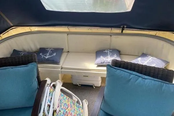 Slide: The Image of Cozy seating area on 1983 Hatteras 53 Motor Yacht with nautical-themed cushions. - 28