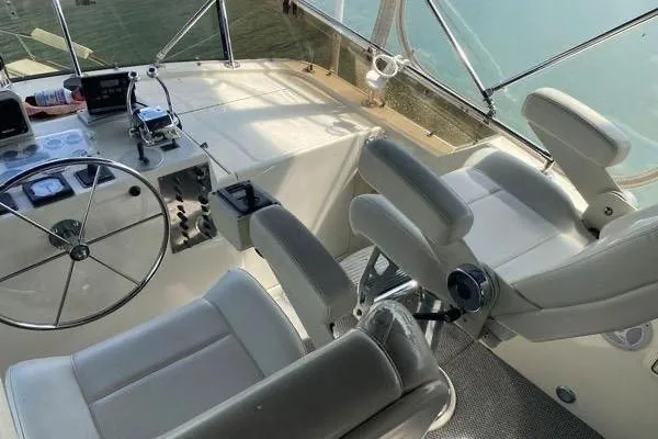 Slide: The Image of Cockpit of 1983 Hatteras 53 Extended Deckhouse Motor Yacht with steering wheel and controls. - 30