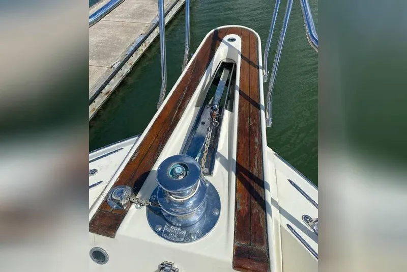 Slide: The Image of Bow view of 1983 Hatteras 53 Extended Deckhouse Motor Yacht with anchor windlass. - 35