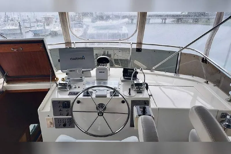 Slide: The Image of Cockpit of 1983 Hatteras 53 Extended Deckhouse Motor Yacht with Garmin navigation system. - 41