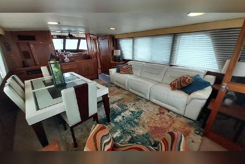 Slide: The Image of Interior of 1983 Hatteras 53 Motor Yacht with modern furnishings and large windows. - 46