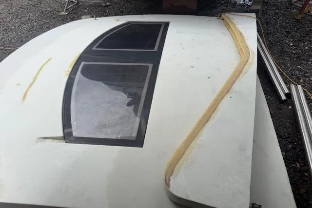 Slide: The Image of 1983 Hatteras 53 Extended Deckhouse Motor Yacht window panel on gravel surface. - 5