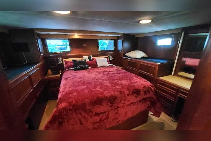 Slide: The Image of Luxurious bedroom interior of 1983 Hatteras 53 Extended Deckhouse Motor Yacht. - 52