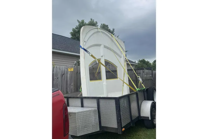 Slide: The Image of Trailer transporting a 1983 Hatteras 53 Extended Deckhouse Motor Yacht part. - 58