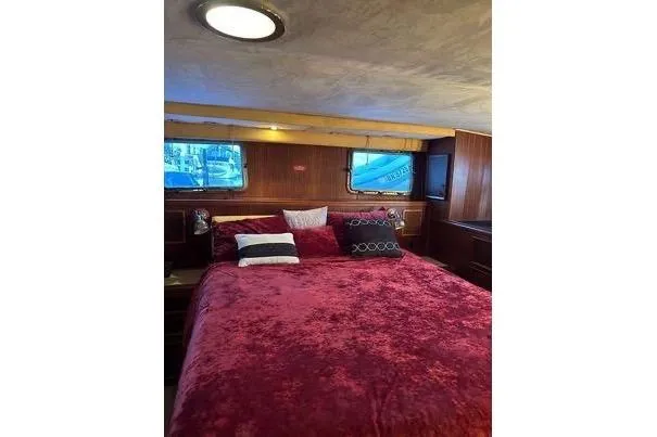 Slide: The Image of Luxurious bedroom interior of 1983 Hatteras 53 Extended Deckhouse Motor Yacht. - 6