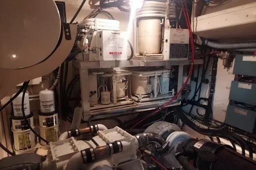 Slide: The Image of Engine room of 1983 Hatteras 53 Extended Deckhouse Motor Yacht with mechanical equipment. - 61