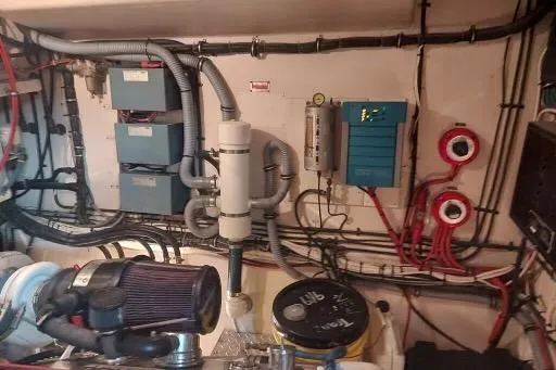 Slide: The Image of Engine room of 1983 Hatteras 53 Extended Deckhouse Motor Yacht with wiring and equipment. - 63