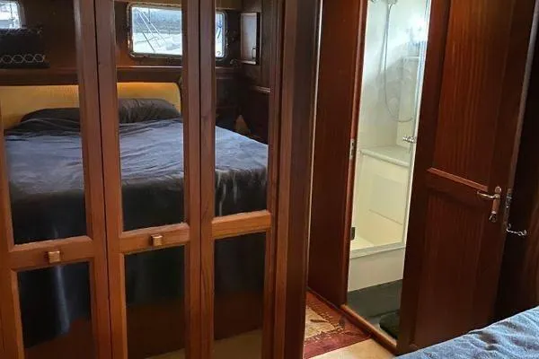 Slide: The Image of Interior of 1983 Hatteras 53 Motor Yacht with bedroom and bathroom. - 8