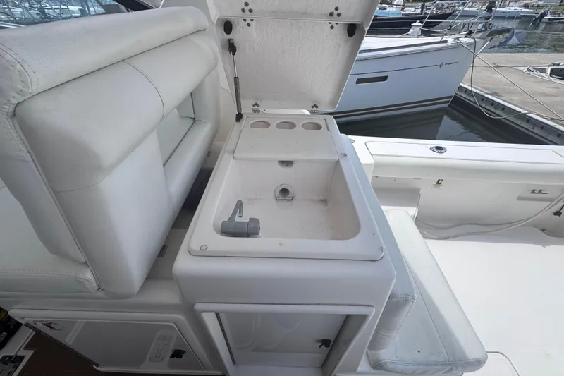 Slide: The Image of 2001 Tiara Yachts 3500 Open boat interior with open storage compartment and seating. - 17