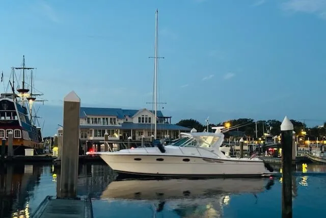 Slide: The Image of 2001 Tiara Yachts 3500 Open docked at a marina during twilight. - 2