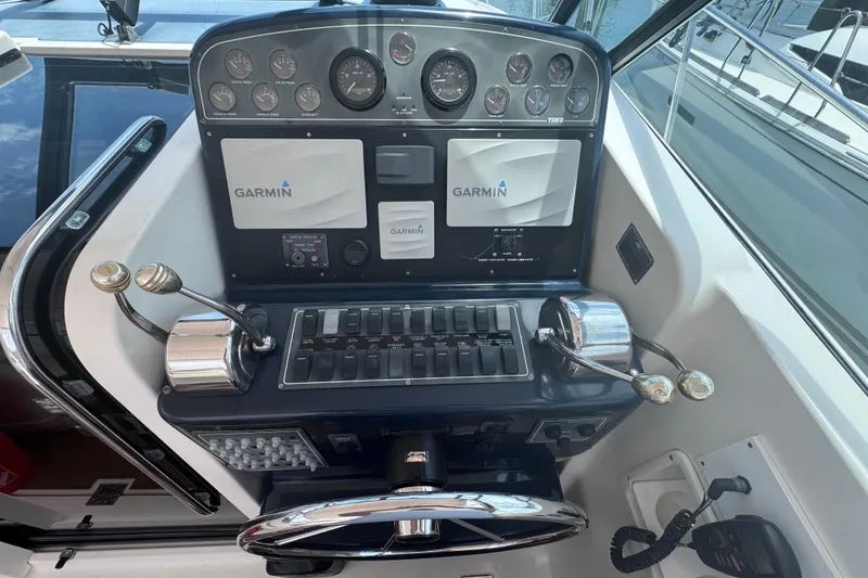 Slide: The Image of Helm of 2001 Tiara Yachts 3500 Open with Garmin navigation system and controls. - 23
