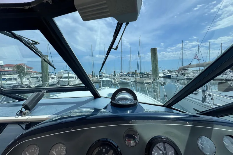 Slide: The Image of Cockpit view from a 2001 Tiara Yachts 3500 Open, docked at a marina. - 25