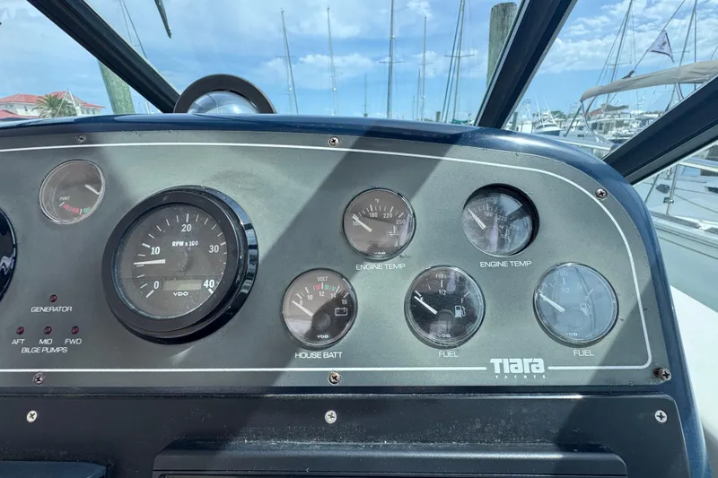 Slide: The Image of Dashboard of a 2001 Tiara Yachts 3500 Open, featuring gauges and controls. - 27