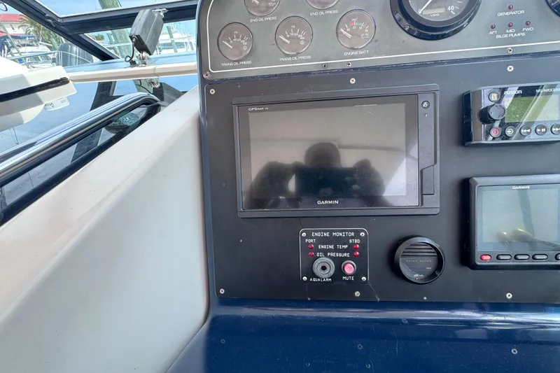 Slide: The Image of Dashboard of a 2001 Tiara Yachts 3500 Open with Garmin navigation system. - 29