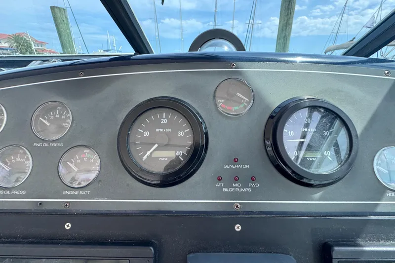 Slide: The Image of Dashboard of a 2001 Tiara Yachts 3500 Open, featuring gauges and controls. - 30