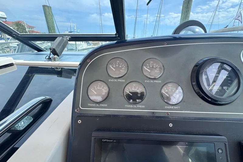 Slide: The Image of Dashboard of a 2001 Tiara Yachts 3500 Open with gauges and controls. - 32
