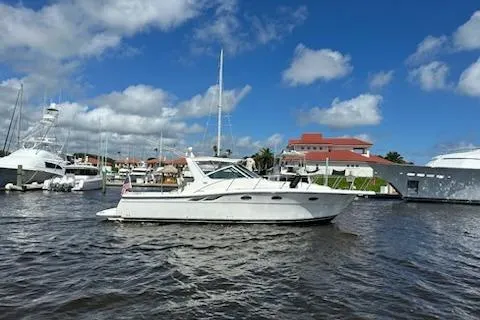 Slide: The Image of 2001 Tiara Yachts 3500 Open in marina, under blue sky with clouds. - 4