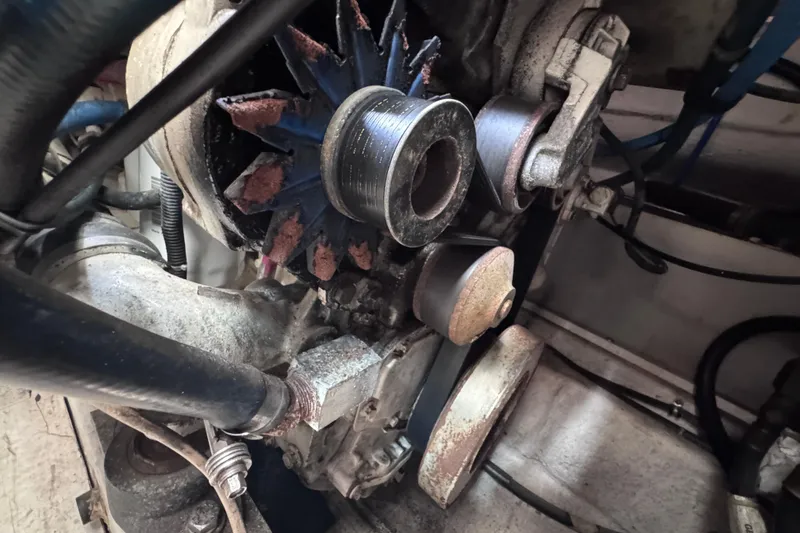 Slide: The Image of Engine components of a 2001 Tiara Yachts 3500 Open, showing belts and pulleys. - 44