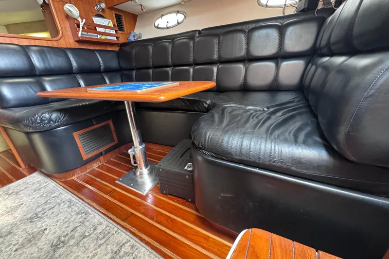 Slide: The Image of Luxurious black leather seating in 2001 Tiara Yachts 3500 Open cabin interior. - 52