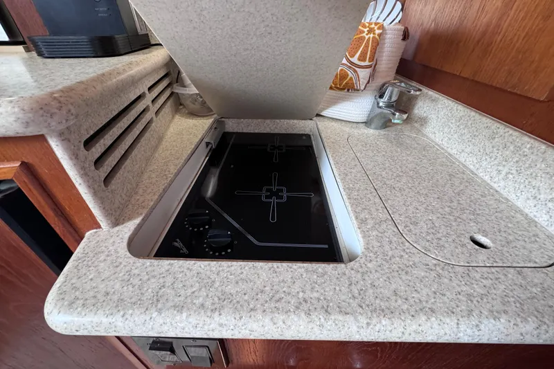Slide: The Image of 2001 Tiara Yachts 3500 Open kitchen with stove and countertop. - 57
