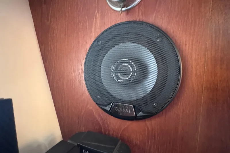 Slide: The Image of Clarion speaker installed on 2001 Tiara Yachts 3500 Open wooden interior. - 64