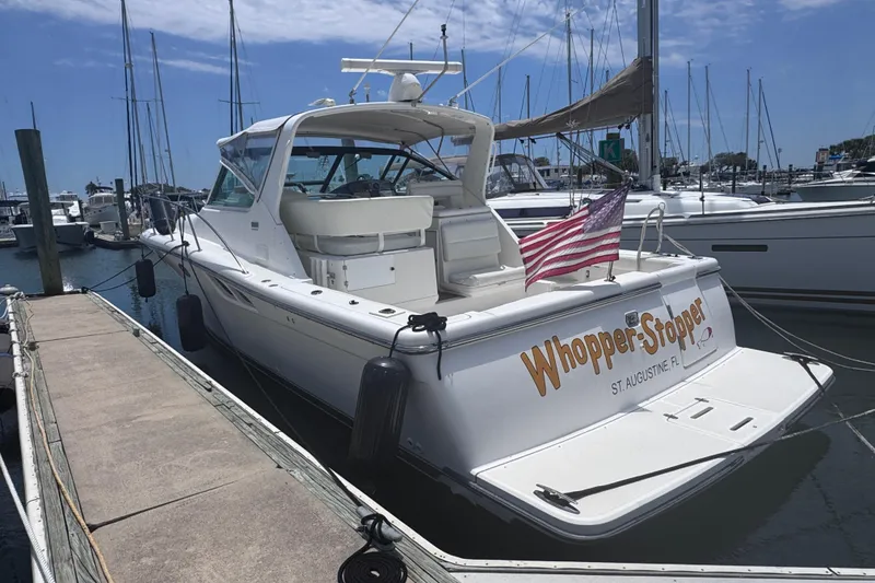 Slide: The Image of 2001 Tiara Yachts 3500 Open docked, displaying "Whopper Stopper" and American flag. - 9