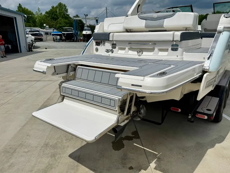 Slide: The Image of 2021 Chaparral 30 Surf boat with fold-out swim platform. - 10