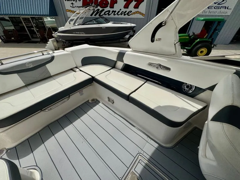 Slide: The Image of Interior of a 2021 Chaparral 30 Surf boat with white seating. - 16