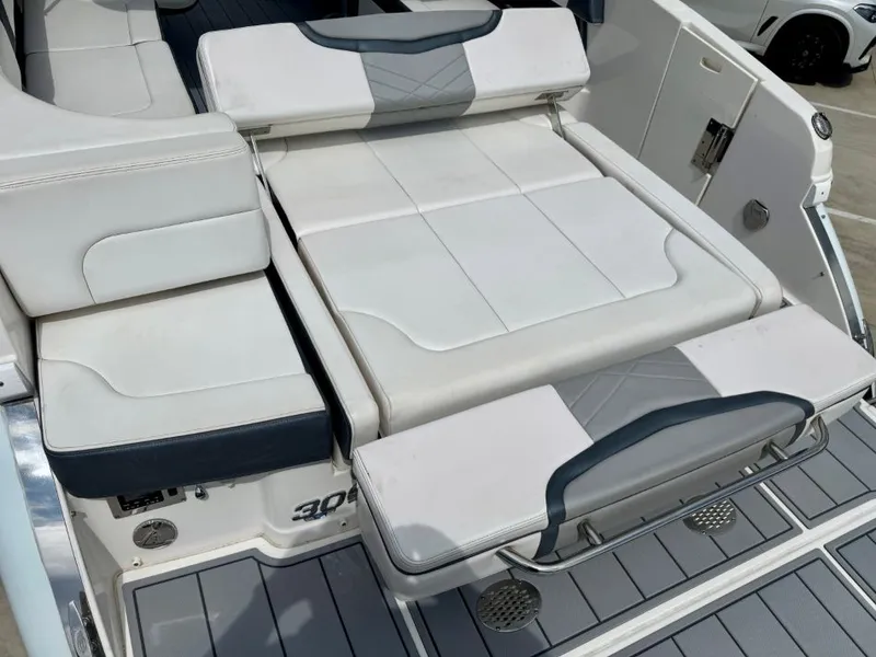 Slide: The Image of 2021 Chaparral 30 Surf boat rear with cushioned seating. - 22