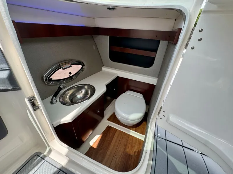 Slide: The Image of Interior of 2021 Chaparral 30 Surf with toilet and sink. - 27