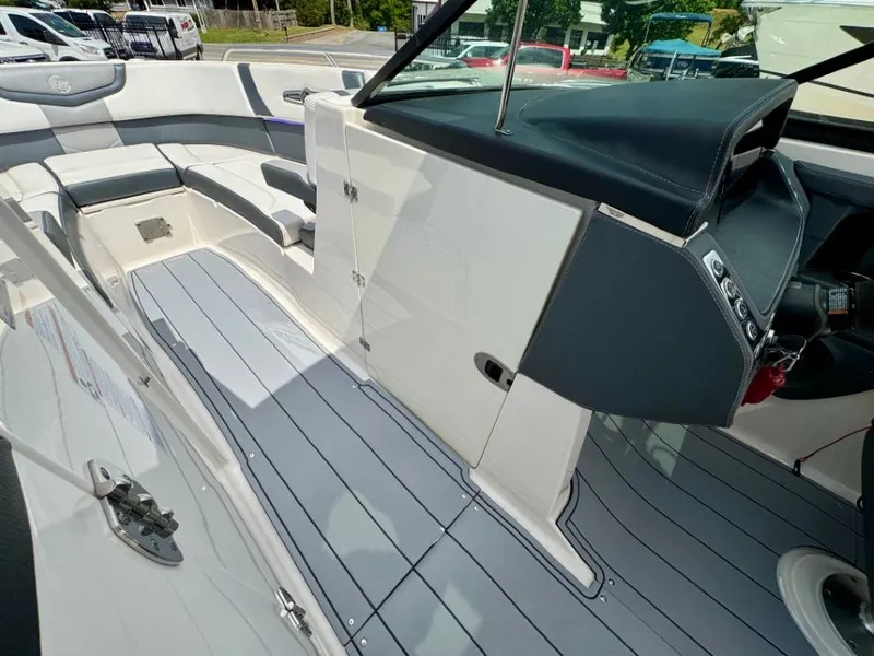 Slide: The Image of Interior of 2021 Chaparral 30 Surf with gray seating and flooring. - 29