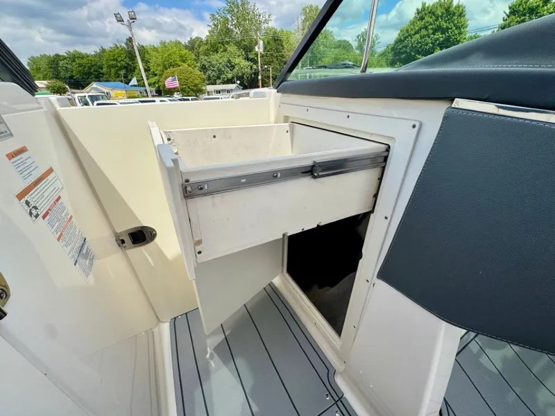 Slide: The Image of Interior of 2021 Chaparral 30 Surf with storage compartment. - 31