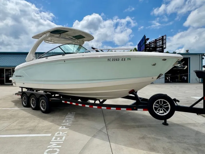 Slide: The Image of 2021 Chaparral 30 Surf boat on trailer outdoors. - 4
