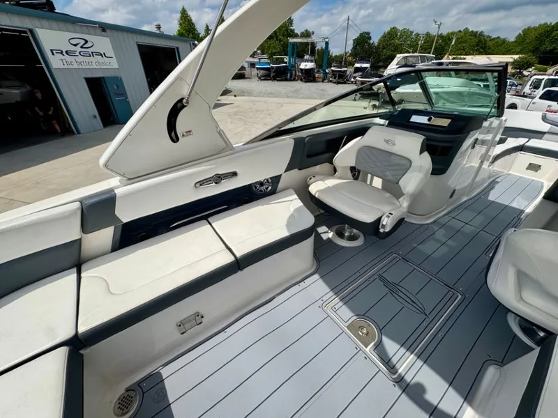Slide: The Image of Interior of 2021 Chaparral 30 Surf with seating and helm area. - 40