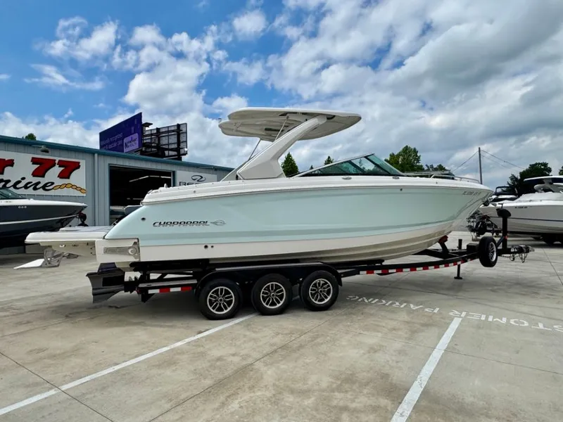 Slide: The Image of 2021 Chaparral 30 Surf boat on trailer outdoors. - 5