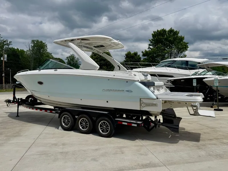 Slide: The Image of 2021 Chaparral 30 Surf boat on trailer outdoors. - 7