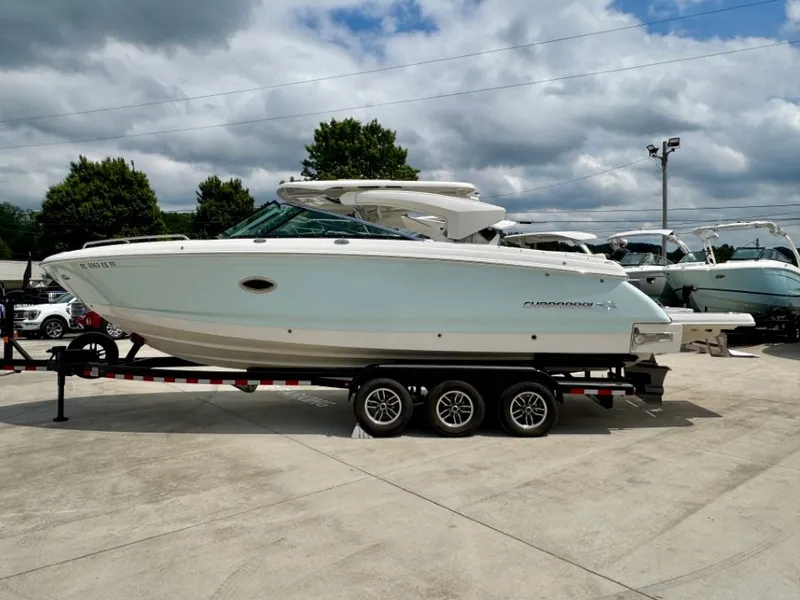 Slide: The Image of 2021 Chaparral 30 Surf boat on trailer outdoors. - 8