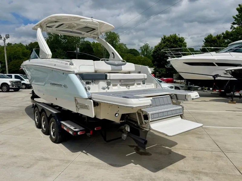 Slide: The Image of 2021 Chaparral 30 Surf boat on trailer outdoors. - 9
