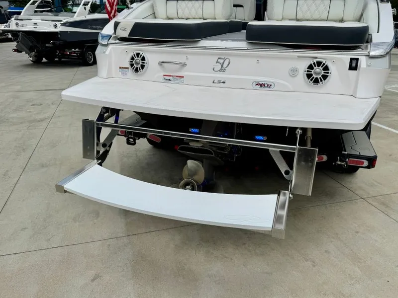 Slide: The Image of Rear view of a 2021 Regal LS4 boat with swim platform. - 10