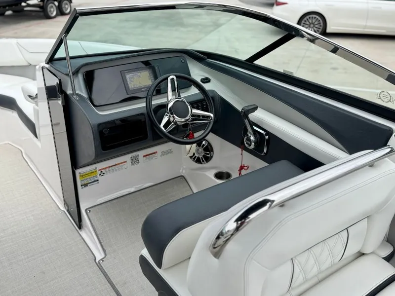 Slide: The Image of Interior of a 2021 Regal LS4 boat with modern dashboard. - 12
