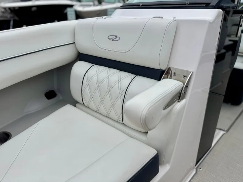 Slide: The Image of Regal LS4 2021 boat seat with white upholstery and quilted design. - 17
