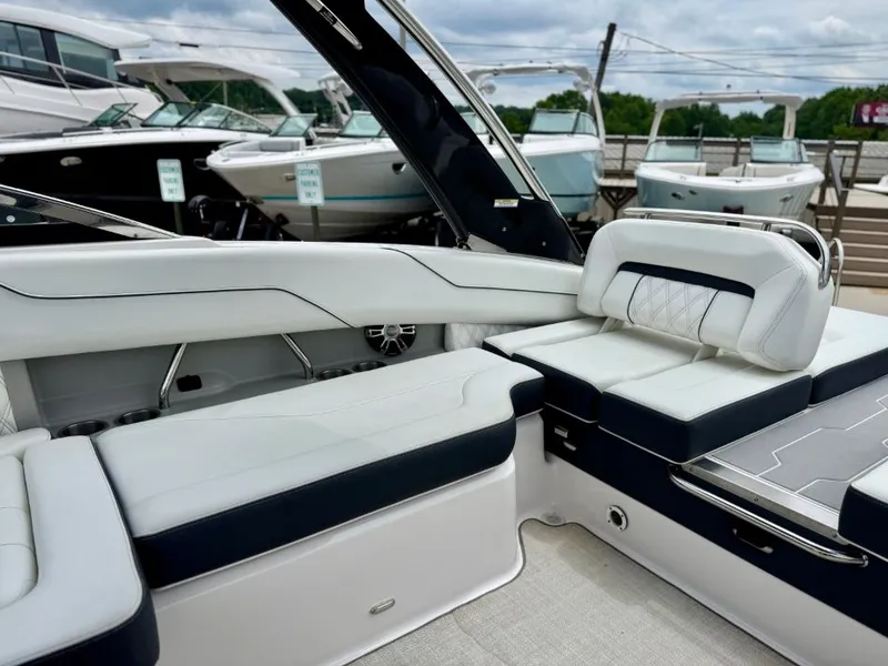 Slide: The Image of Interior of a 2021 Regal LS4 boat with luxurious white seating. - 24