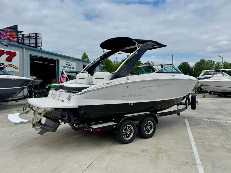 Slide: The Image of 2021 Regal LS4 boat on trailer at Regal dealership. - 4